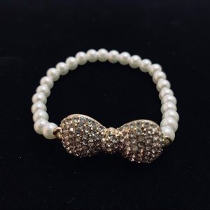 Faux pearl stretch bracelet gold‎ bow bracelet